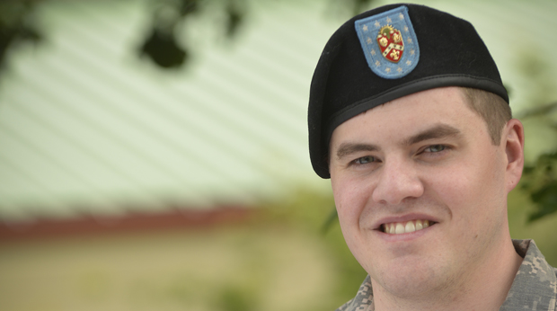 Veteran student stands outside on the La Roche University campus